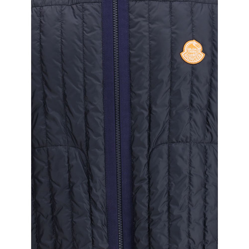 Blue Polyamide Sleveless JacketThe Moncler x Gilga Farm Down Vest by Donald Glover, named Tangerine after the orange groves of Gilga Farm, combines lightness and functionality. Crafted from longue saison, a lightweight and protective nylon, it features wa
