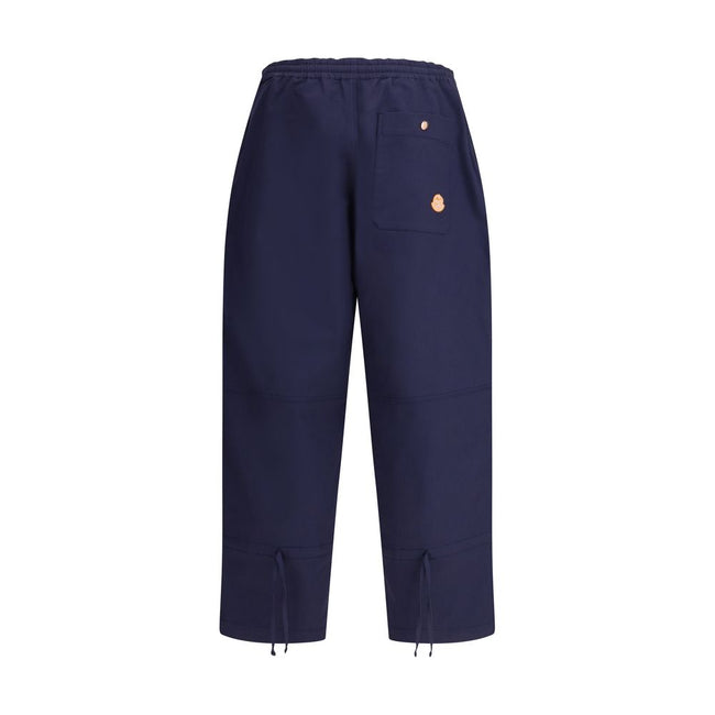 Blue Cotton Casual PantsThe Moncler x Gilga Farm cotton gabardine Pants by Donald Glover combine functionality with contemporary style. Part of the Moncler Genius line, they feature an elasticated waistband and two side welt pockets. A drawstring leg allo