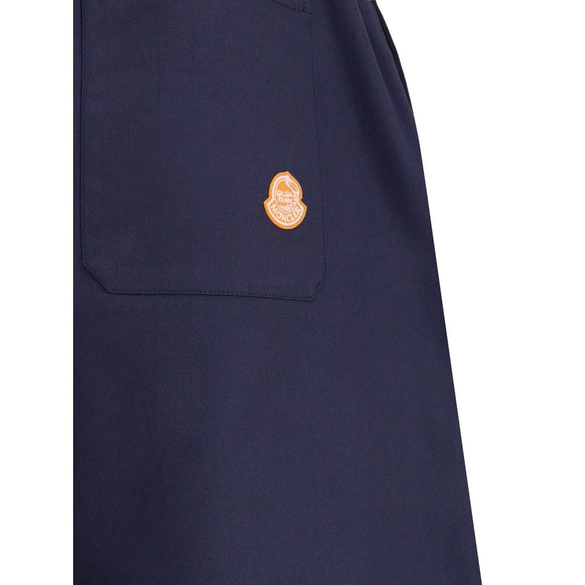 Blue Cotton Casual PantsThe Moncler x Gilga Farm cotton gabardine Pants by Donald Glover combine functionality with contemporary style. Part of the Moncler Genius line, they feature an elasticated waistband and two side welt pockets. A drawstring leg allo