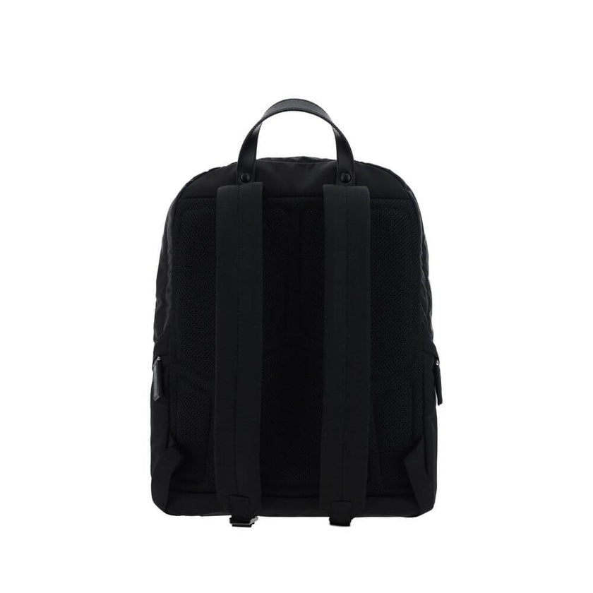 Black Nylon BackpackRe-Nylon backpack by Prada, handle on leather top, adjustable shoulder straps, padded mesh back, zippered top closure, interior slit pocket with zipper closure, interior patch pocket, two exterior zippered pockets, contrasting iconic m