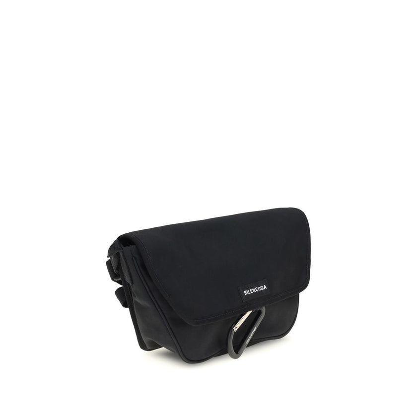 Black Polyamide Shoulder BagBalenciaga’s Explorer small Shoulder Bag is made of polyamide and polyester with a washed-out effect with a vintage character. This messenger model can be carried either over the shoulder or cross-body, thanks to the adjustable