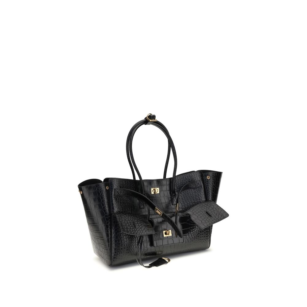 Black Calf Leather Bos Taurus Shoulder BagBalenciaga’s Bel Air medium Shoulder Bag is a sophisticated accessory in crocodile-effect calfskin leather. A versatile carry all, it can be carried either on the shoulder or in the hand thanks to the two handles