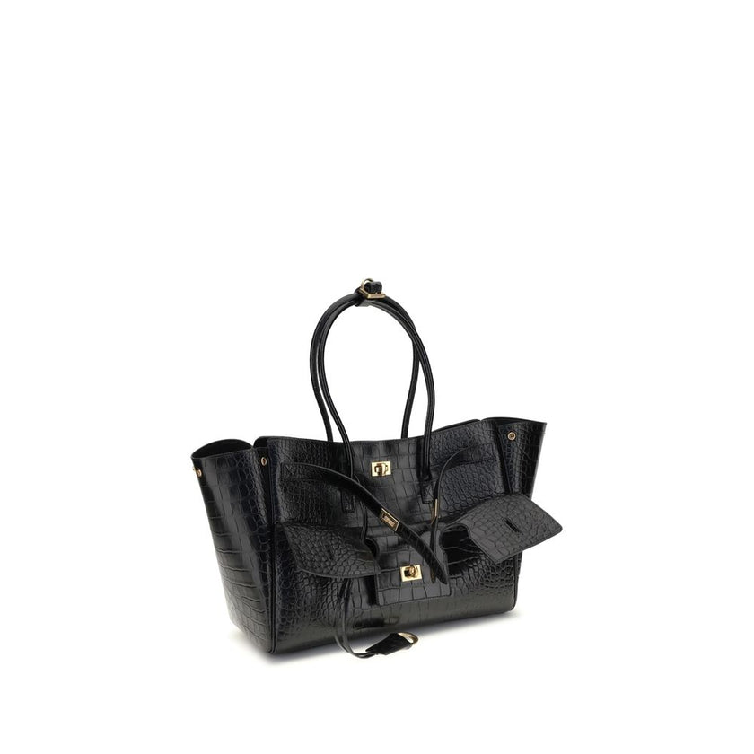 Black Calf Leather Bos Taurus Shoulder BagBalenciaga’s Bel Air medium Shoulder Bag is a sophisticated accessory in crocodile-effect calfskin leather. A versatile carry all, it can be carried either on the shoulder or in the hand thanks to the two handles