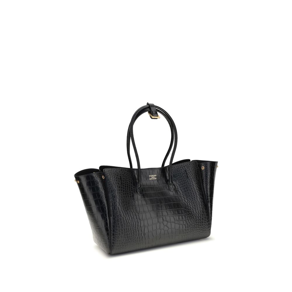 Black Calf Leather Bos Taurus Shoulder BagBalenciaga’s Bel Air medium Shoulder Bag is a sophisticated accessory in crocodile-effect calfskin leather. A versatile carry all, it can be carried either on the shoulder or in the hand thanks to the two handles