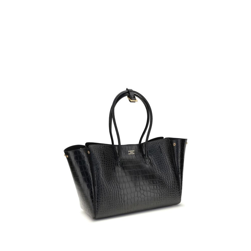 Black Calf Leather Bos Taurus Shoulder BagBalenciaga’s Bel Air medium Shoulder Bag is a sophisticated accessory in crocodile-effect calfskin leather. A versatile carry all, it can be carried either on the shoulder or in the hand thanks to the two handles
