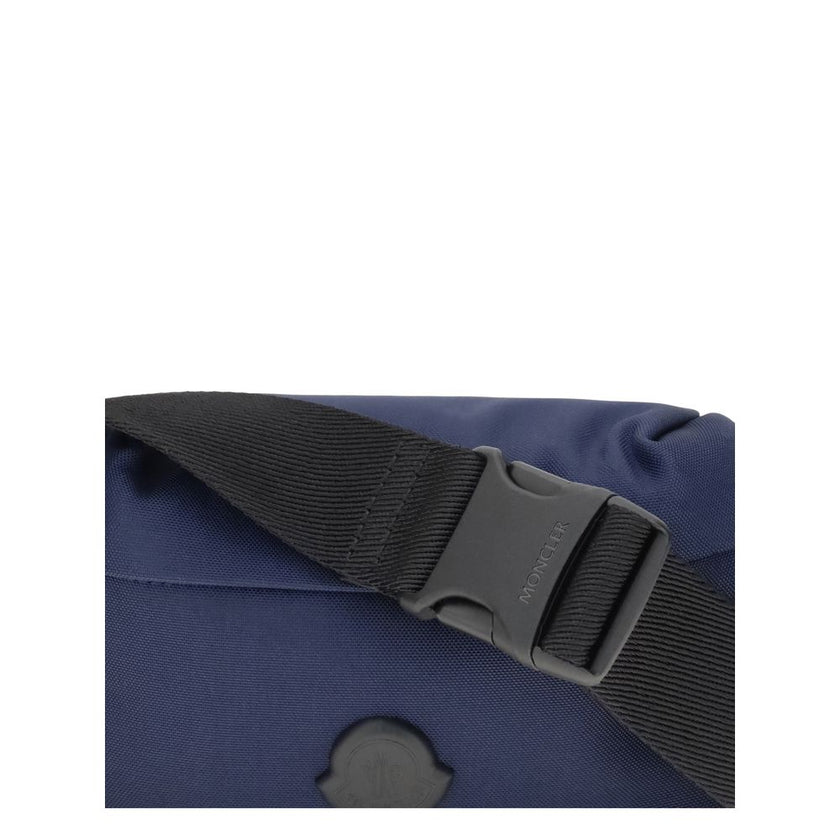 Blue Nylon Clutch BagMoncler’s Durance Fanny Pack is made of water-repellent nylon, perfect for providing protection and water resistance. Enhanced with quality leather trim, it features an adjustable belt for a customizable fit. The zippered closure and
