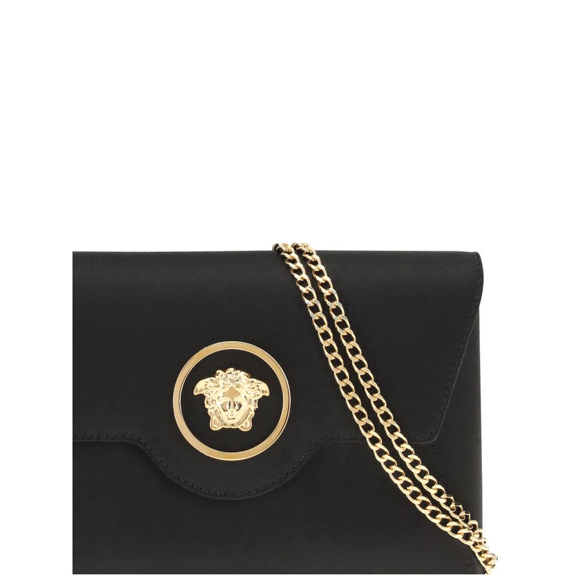 Black Calf Leather Bos Taurus Shoulder BagThe La Medusa Shoulder Bag by Versace is an elegant and iconic accessory, embellished with the distinctive metal La Medusa detail applied to the front flap. Equipped with a practical interior slit pocket, it featu