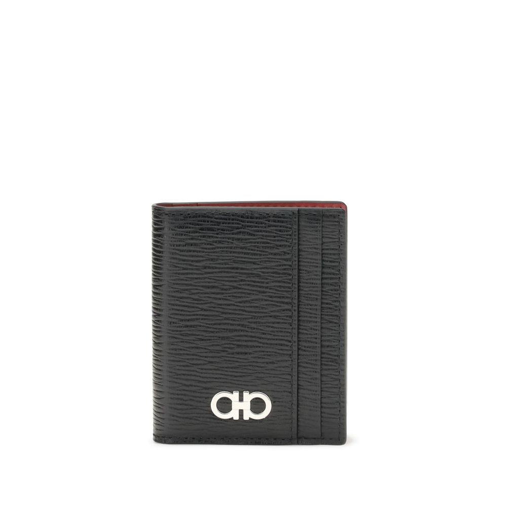 Black Calf Leather Bos Taurus WalletFerragamo’s Gancini Card Holder is a compact and elegant accessory designed for refined everyday use. The bifold design is embellished with a Gancini logo plaque on the front, while two card compartments are featured on