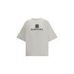 Gray Cotton T-ShirtBalenciaga’s Logo T-Shirt combines a minimal aesthetic with the house’s signature oversized lines. Made from soft cotton, it features a ribbed crew neck and dropped shoulders for a relaxed, contemporary fit. The printed logo on the fron