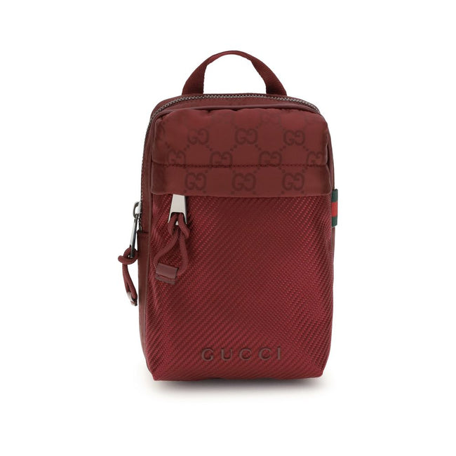 Bordeaux Polyamide Shoulder BagGucci’s Nexus Mini Shoulder Bag is made of Gucci Rosso Ancora GG nylon, featuring the iconic green and red web that underscores its distinctive style. It features a tone-on-tone Gucci logo and a coordinating Gucci Rosso Anco