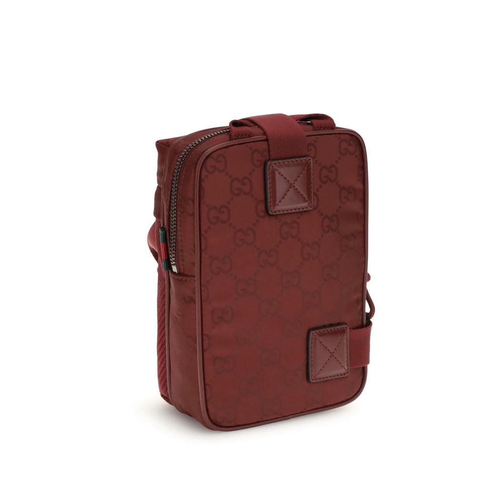 Bordeaux Polyamide Shoulder BagGucci’s Nexus Mini Shoulder Bag is made of Gucci Rosso Ancora GG nylon, featuring the iconic green and red web that underscores its distinctive style. It features a tone-on-tone Gucci logo and a coordinating Gucci Rosso Anco