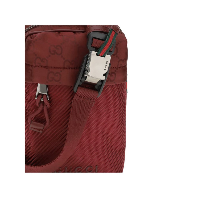 Bordeaux Polyamide Shoulder BagGucci’s Nexus Mini Shoulder Bag is made of Gucci Rosso Ancora GG nylon, featuring the iconic green and red web that underscores its distinctive style. It features a tone-on-tone Gucci logo and a coordinating Gucci Rosso Anco