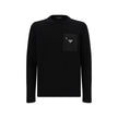 Black Fleece Wool SweatshirtVirgin Wool Knitwear by Prada, ribbed crew neck, zipper pocket applique on front, iconic triangular metal brand logo plaque on front, monochrome pattern. Season: AW25 Composition: 100% Fleece Wool MADE IN ITALYBlack Fleece Wool