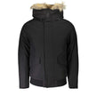 Black Cotton Men JacketExperience the pinnacle of urban sophistication with this luxurious Woolrich long-sleeved jacket. Tailored to perfection, it features a detachable fur-lined hood for versatile styling and warmth. Boasting a sleek black hue, this jac