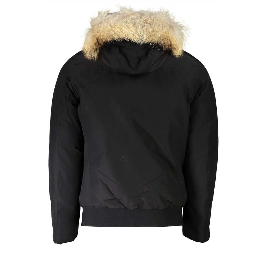 Black Cotton Men JacketExperience the pinnacle of urban sophistication with this luxurious Woolrich long-sleeved jacket. Tailored to perfection, it features a detachable fur-lined hood for versatile styling and warmth. Boasting a sleek black hue, this jac
