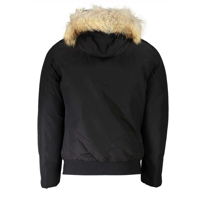 Black Cotton Men JacketExperience the pinnacle of urban sophistication with this luxurious Woolrich long-sleeved jacket. Tailored to perfection, it features a detachable fur-lined hood for versatile styling and warmth. Boasting a sleek black hue, this jac