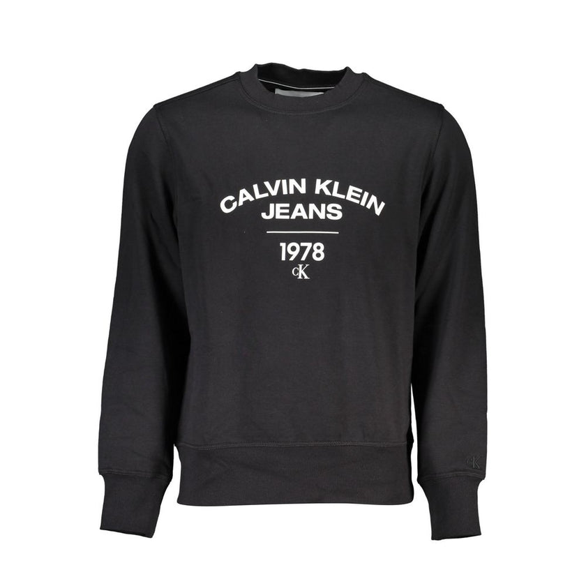 Black Cotton Men SweaterDive into the world of upscale comfort with Calvin Klein’s long sleeve sweatshirt. A sleek black hue meets the iconic logo emblazoned front and center, offering a bold statement piece for your wardrobe. Crafted from a cozy blend of