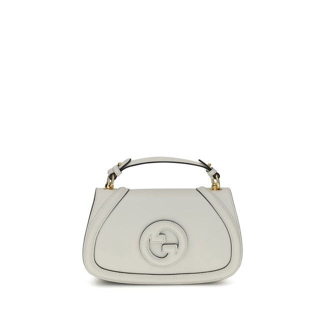 White Calf Leather Bos Taurus HandbagGucci’s Blondie Handbag, made of smooth leather, features an elegant tonal leather GG applique on the front. Equipped with a removable flat handle and adjustable shoulder strap also in tonal leather, it offers multiple