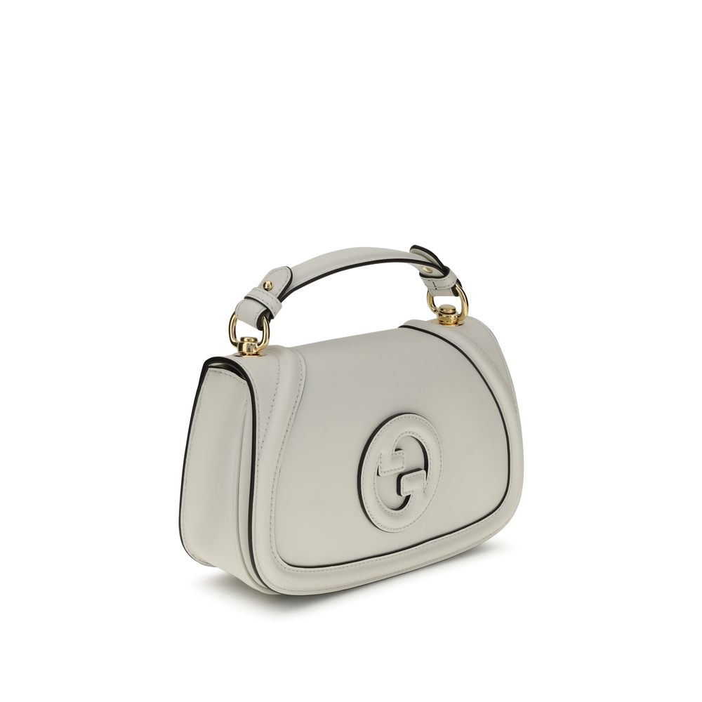 White Calf Leather Bos Taurus HandbagGucci’s Blondie Handbag, made of smooth leather, features an elegant tonal leather GG applique on the front. Equipped with a removable flat handle and adjustable shoulder strap also in tonal leather, it offers multiple