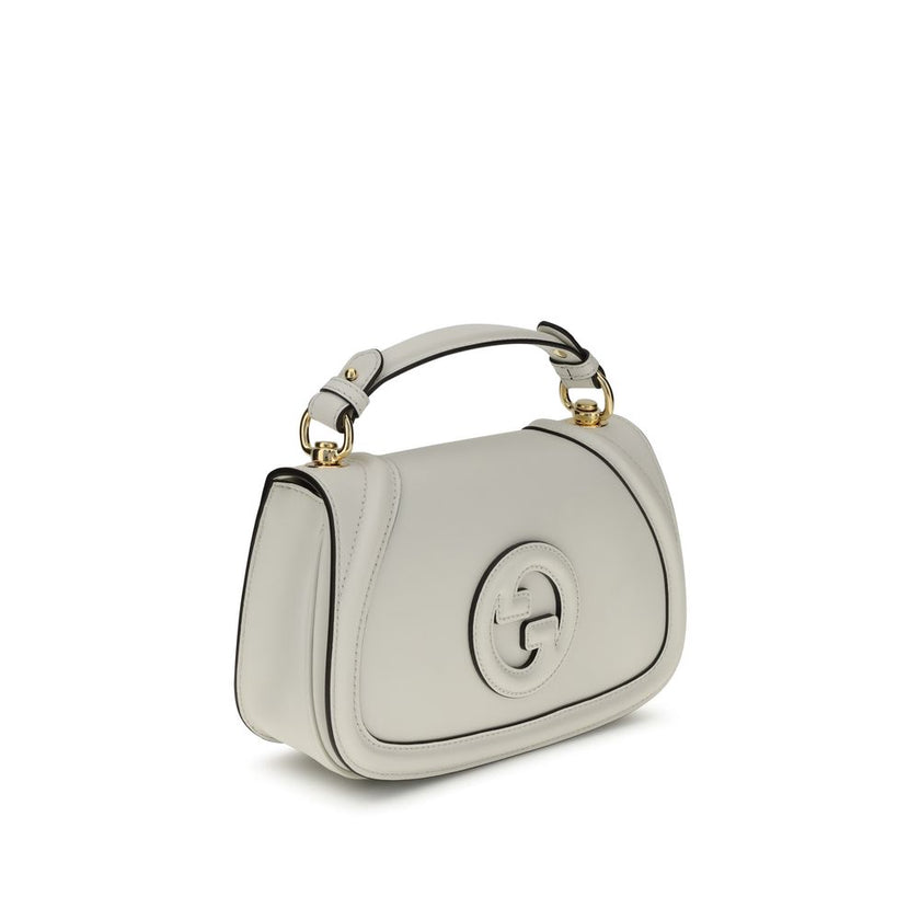 White Calf Leather Bos Taurus HandbagGucci’s Blondie Handbag, made of smooth leather, features an elegant tonal leather GG applique on the front. Equipped with a removable flat handle and adjustable shoulder strap also in tonal leather, it offers multiple