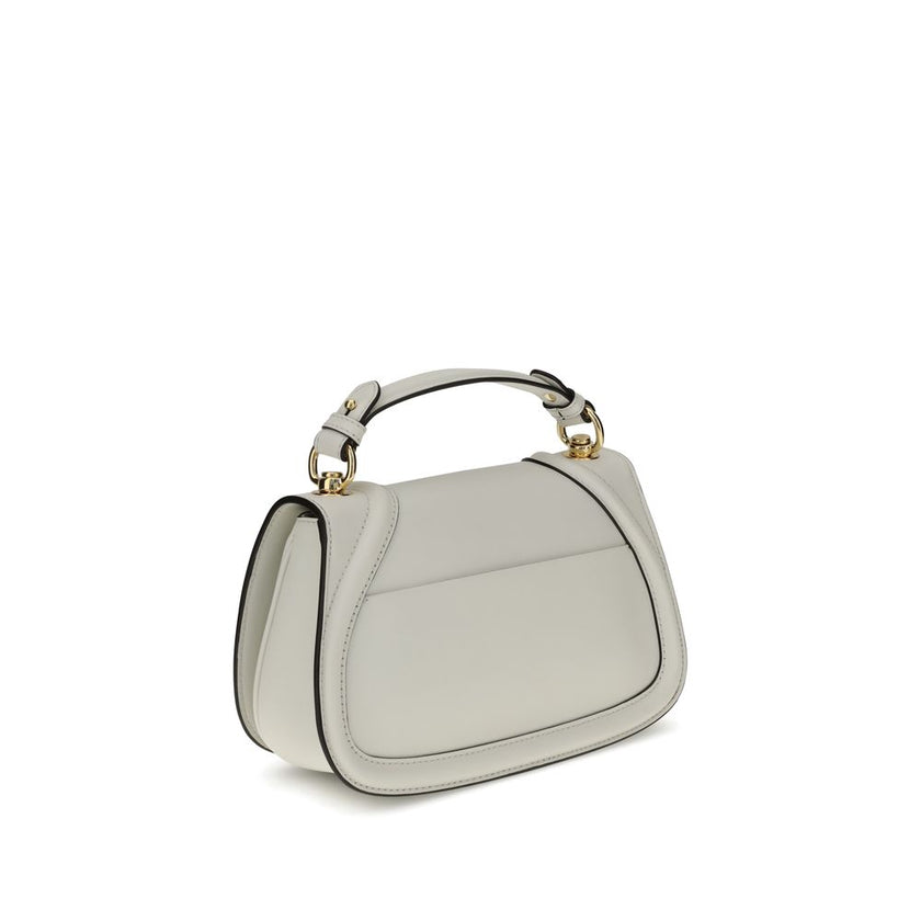 White Calf Leather Bos Taurus HandbagGucci’s Blondie Handbag, made of smooth leather, features an elegant tonal leather GG applique on the front. Equipped with a removable flat handle and adjustable shoulder strap also in tonal leather, it offers multiple