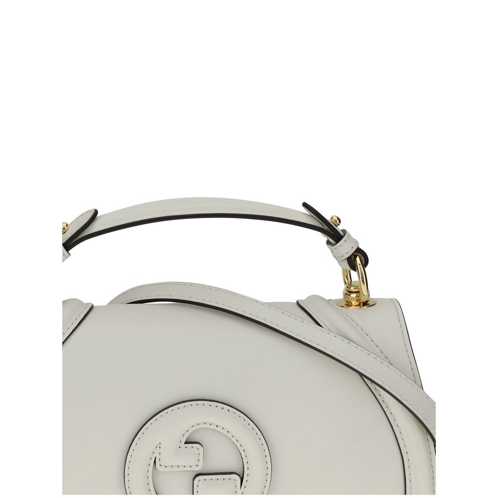 White Calf Leather Bos Taurus HandbagGucci’s Blondie Handbag, made of smooth leather, features an elegant tonal leather GG applique on the front. Equipped with a removable flat handle and adjustable shoulder strap also in tonal leather, it offers multiple