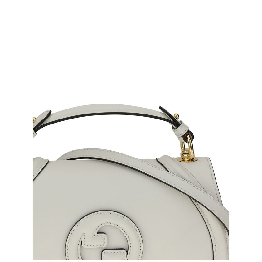 White Calf Leather Bos Taurus HandbagGucci’s Blondie Handbag, made of smooth leather, features an elegant tonal leather GG applique on the front. Equipped with a removable flat handle and adjustable shoulder strap also in tonal leather, it offers multiple