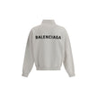 White Cotton SweatshirtBalenciaga’s Logo Sweatshirt stands out for its worn effect, which gives the garment a worn and contemporary character. On the front it features two patch pockets, practical and with a casual look, while the hem and cuffs are finish