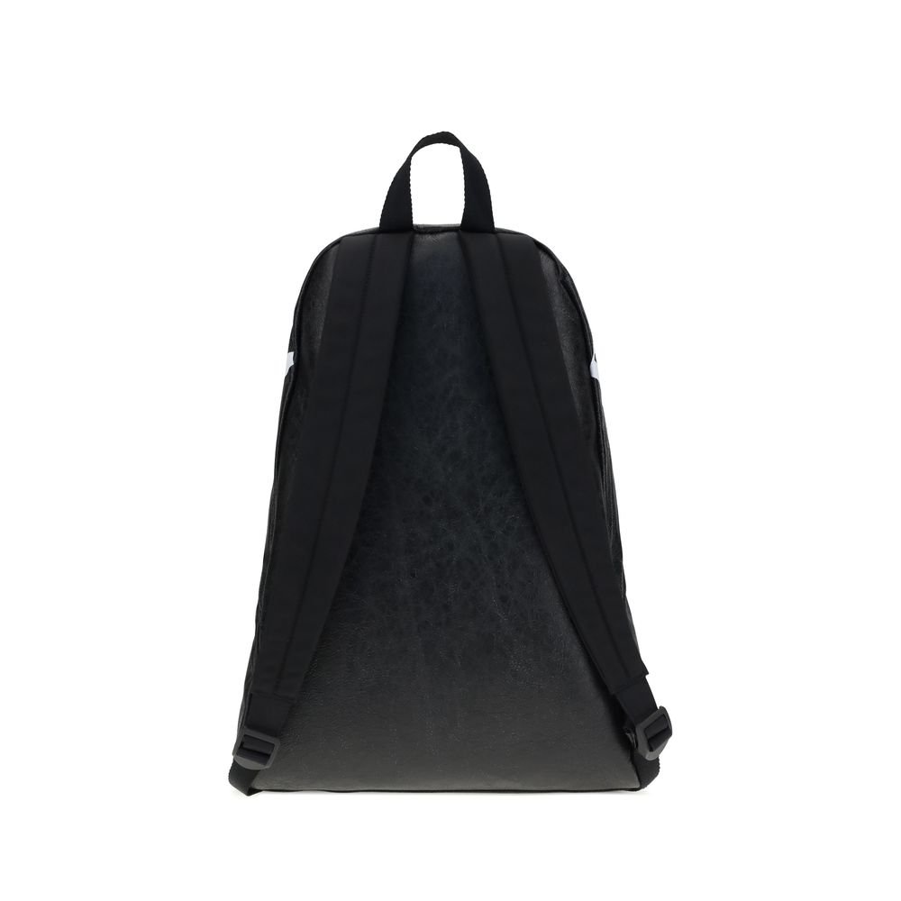 Black Lamb Ovis Aries Aries BackpackThe Crinkle Effect lambskin Backpack stands out for its modern design and soft, refined texture. The printed logo on the top adds a graphic and distinctive touch. Featuring a tone-on-tone fabric flat handle, adjustable