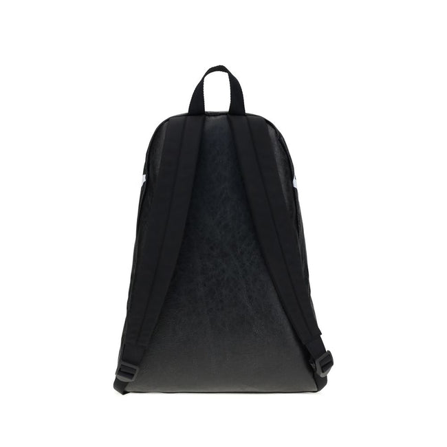 Black Lamb Ovis Aries Aries BackpackThe Crinkle Effect lambskin Backpack stands out for its modern design and soft, refined texture. The printed logo on the top adds a graphic and distinctive touch. Featuring a tone-on-tone fabric flat handle, adjustable