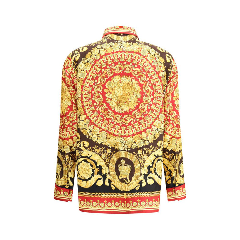 Multicolor Silk Pattern ShirtVersace’s Pure Silk Shirt is a luxury garment with distinctive character, embellished with the iconic Barocco print that decorates the entire surface. The short point collar and concealed button closure enhance the sophisticat
