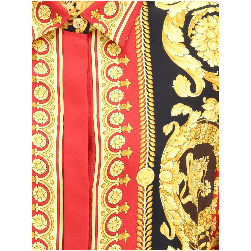 Multicolor Silk Pattern ShirtVersace’s Pure Silk Shirt is a luxury garment with distinctive character, embellished with the iconic Barocco print that decorates the entire surface. The short point collar and concealed button closure enhance the sophisticat