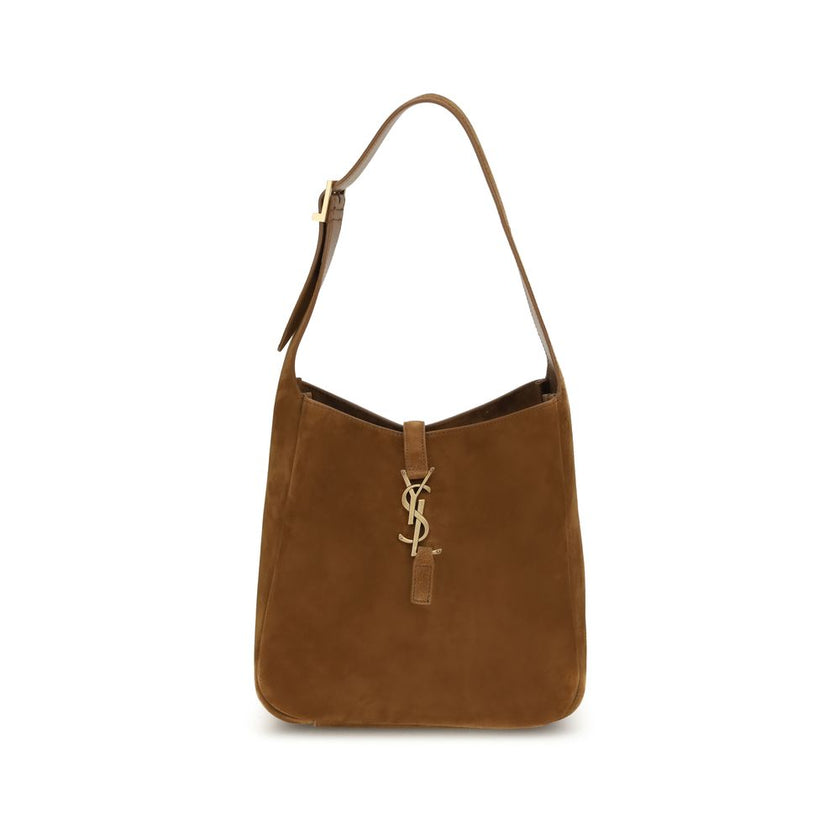 Brown Calf Leather Bos Taurus Shoulder BagThe Le 5 à 7 Shoulder Bag by Saint Laurent, made of suede leather, is an elegant accessory that combines sophistication and practicality. The adjustable flat handle, located at the top, allows it to be carried com