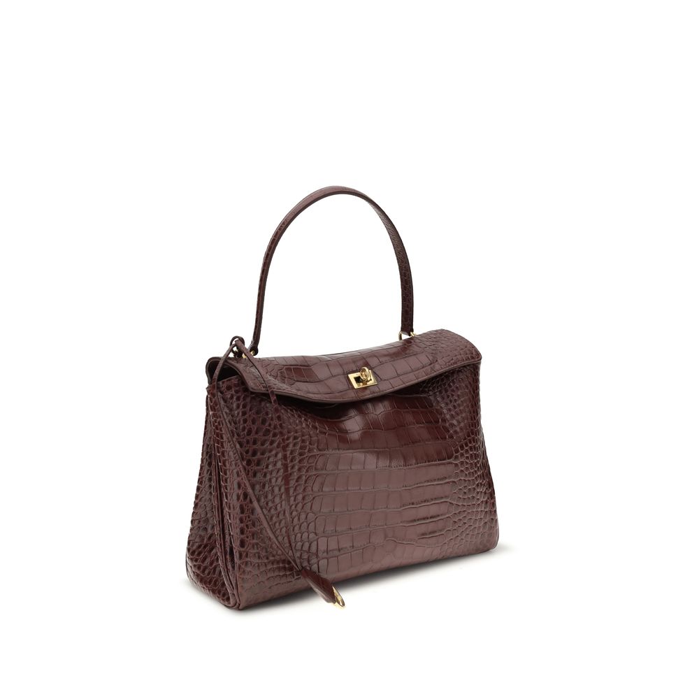 Brown Calf Leather Bos Taurus HandbagLeather Medium Rodeo Handbag by Balenciaga, single removable top handle, charm with key ring detail applied at base of handle, dual compartment, flap closure with swivel system at front, crocodile-effect leather design