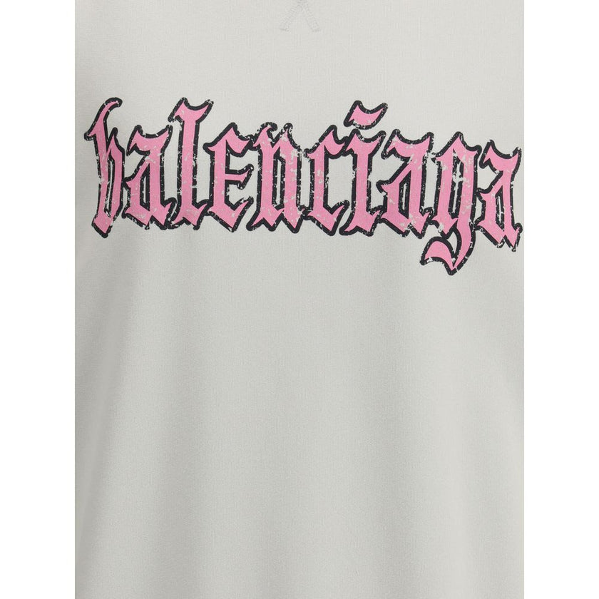 Multicolor Cotton SweatshirtBalenciaga’s Sweatshirt Dress combines comfort and urban style with a distinctive touch. Featuring a contrasting printed logo on the front, it features a ribbed collar and cuffs and dropped shoulders for a relaxed fit. A worn-i