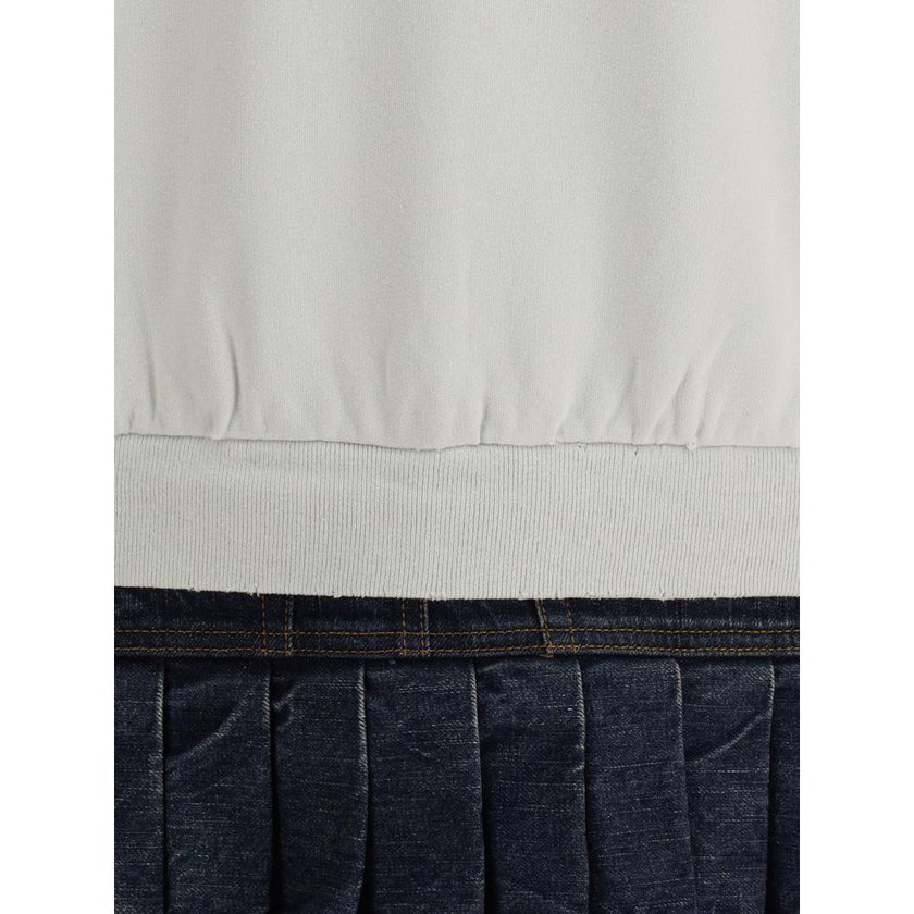 Multicolor Cotton SweatshirtBalenciaga’s Sweatshirt Dress combines comfort and urban style with a distinctive touch. Featuring a contrasting printed logo on the front, it features a ribbed collar and cuffs and dropped shoulders for a relaxed fit. A worn-i