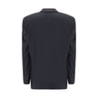 Black Wool ClothingBalenciaga’s deconstructed Blazer is a garment with a bold, contemporary style designed for those who like to dare with elegance. Unlined for a lighter, more casual effect, it features extended shoulders enhanced by internal straps that