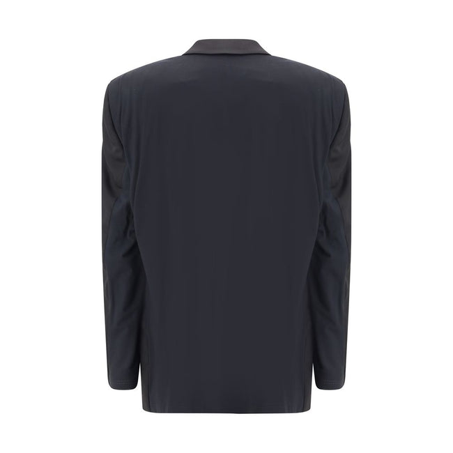 Black Wool ClothingBalenciaga’s deconstructed Blazer is a garment with a bold, contemporary style designed for those who like to dare with elegance. Unlined for a lighter, more casual effect, it features extended shoulders enhanced by internal straps that