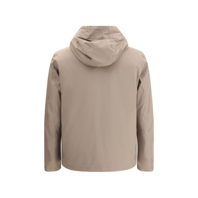Beige Polyester Shell JacketWoolrich’s Crestmont Jacket combines functionality and versatility in a clean, contemporary design. Featuring an adjustable drawstring hood, it is designed to adapt to different weather conditions thanks to the ability to remov