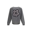 Boke Flower CardiganKenzo’s Boke Flower Cardigan, made from a fine blend of cotton and wool, combines tradition and modernity with a richly detailed design. Featuring a V-neckline and raglan sleeves, it offers a relaxed and comfortable fit. The front clos