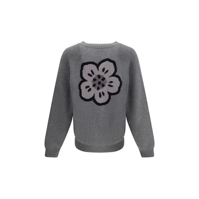 Boke Flower CardiganKenzo’s Boke Flower Cardigan, made from a fine blend of cotton and wool, combines tradition and modernity with a richly detailed design. Featuring a V-neckline and raglan sleeves, it offers a relaxed and comfortable fit. The front clos