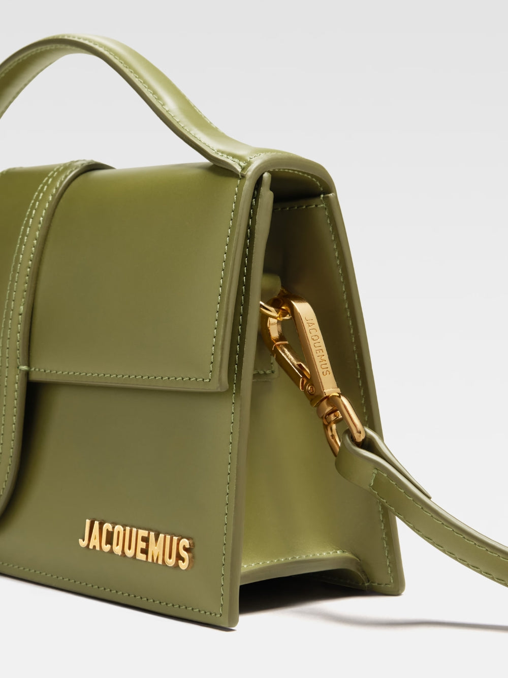 Le Grand Bambino Khaki BagJACQUEMUS Gorgeous brand new, 100% Authentic Jacquemus Le Grand Bambino Khaki Bag. Model: 213BA007-3100-560 Color: Khaki with Gold Hardware Material: Leather Bag with adjustable shoulder strap – Small handle – Removable shoulder