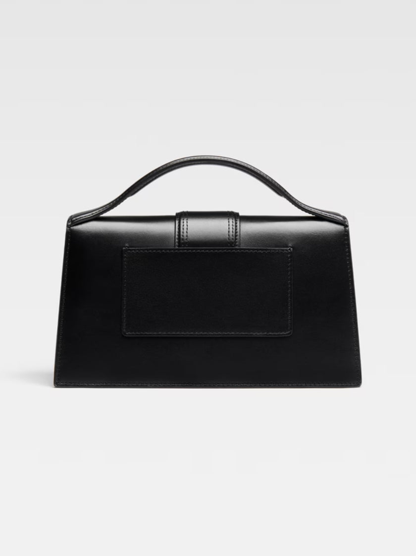 Le Grand Bambino Black BagJACQUEMUS Gorgeous brand new, 100% Authentic Jacquemus Le Grand Bambino BlackBag. Model: 213BA007-3000-990 Color: Black with Gold Hardware Material: Leather Bag with adjustable shoulder strap – Small handle – Removable shoulder s