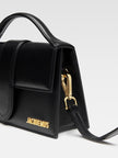 Le Grand Bambino Black BagJACQUEMUS Gorgeous brand new, 100% Authentic Jacquemus Le Grand Bambino BlackBag. Model: 213BA007-3000-990 Color: Black with Gold Hardware Material: Leather Bag with adjustable shoulder strap – Small handle – Removable shoulder s
