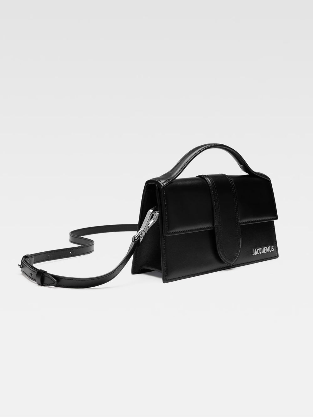 Le Grand Bambino Black BagJACQUEMUS Gorgeous brand new, 100% Authentic Jacquemus Le Grand Bambino Black Bag. Model: 213BA007-3000-99S Color: Black with Silver Hardware Material: Leather Bag with adjustable shoulder strap – Small handle – Removable shoulde