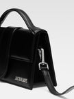 Le Grand Bambino Black BagJACQUEMUS Gorgeous brand new, 100% Authentic Jacquemus Le Grand Bambino Black Bag. Model: 213BA007-3000-99S Color: Black with Silver Hardware Material: Leather Bag with adjustable shoulder strap – Small handle – Removable shoulde