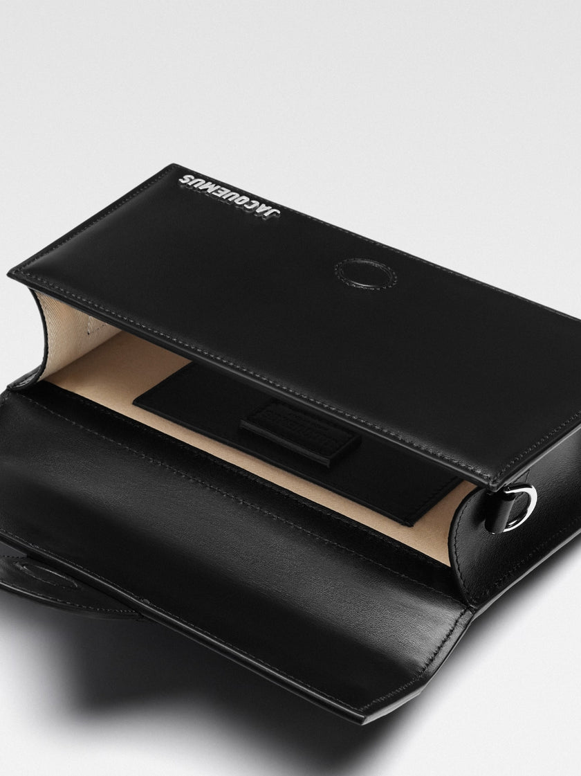 Le Grand Bambino Black BagJACQUEMUS Gorgeous brand new, 100% Authentic Jacquemus Le Grand Bambino Black Bag. Model: 213BA007-3000-99S Color: Black with Silver Hardware Material: Leather Bag with adjustable shoulder strap – Small handle – Removable shoulde