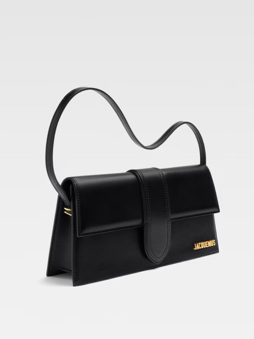 Le Bambino Long Black BagJACQUEMUS Gorgeous brand new, 100% Authentic Jacquemus Le Bambino Long Black Bag Model: 213BA007-3066-390 Color: Black with Gold Hardware – Leather shoulder bag – Magnetic flap closure – Thin, non-adjustable shoulder strap – Insid