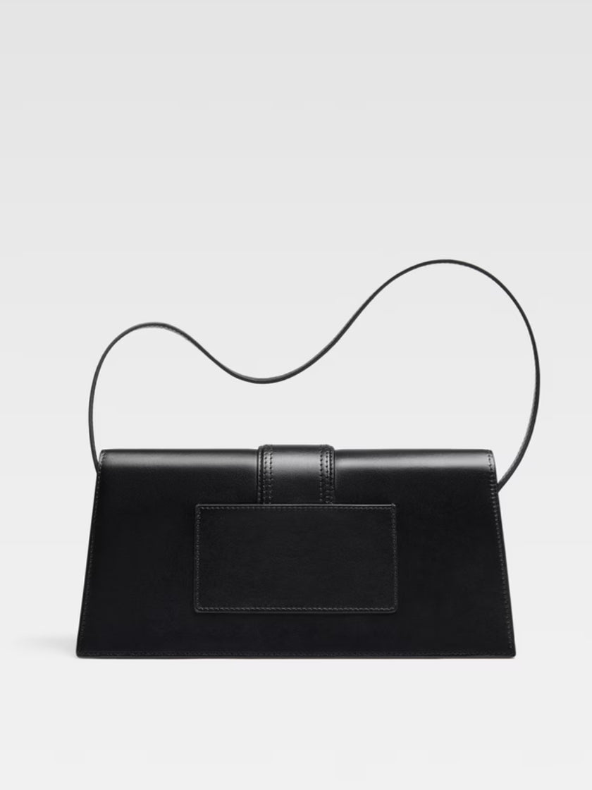 Le Bambino Long Black BagJACQUEMUS Gorgeous brand new, 100% Authentic Jacquemus Le Bambino Long Black Bag Model: 213BA007-3066-390 Color: Black with Gold Hardware – Leather shoulder bag – Magnetic flap closure – Thin, non-adjustable shoulder strap – Insid