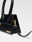 Le Chiquito Moyen Black BagJACQUEMUS Gorgeous brand new, 100% Authentic Jacquemus Le Chiquito Moyen Black Bag Model: BAW00002BC01C01990 Color: Black with Gold Hardware – Reinforced handle – Magnetic flap closure – Removable long shoulder strap – Inside po